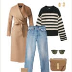 image of a winter capsule wardrobe outfit with a striped black and white sweater, jeans, and a long camel wool coat