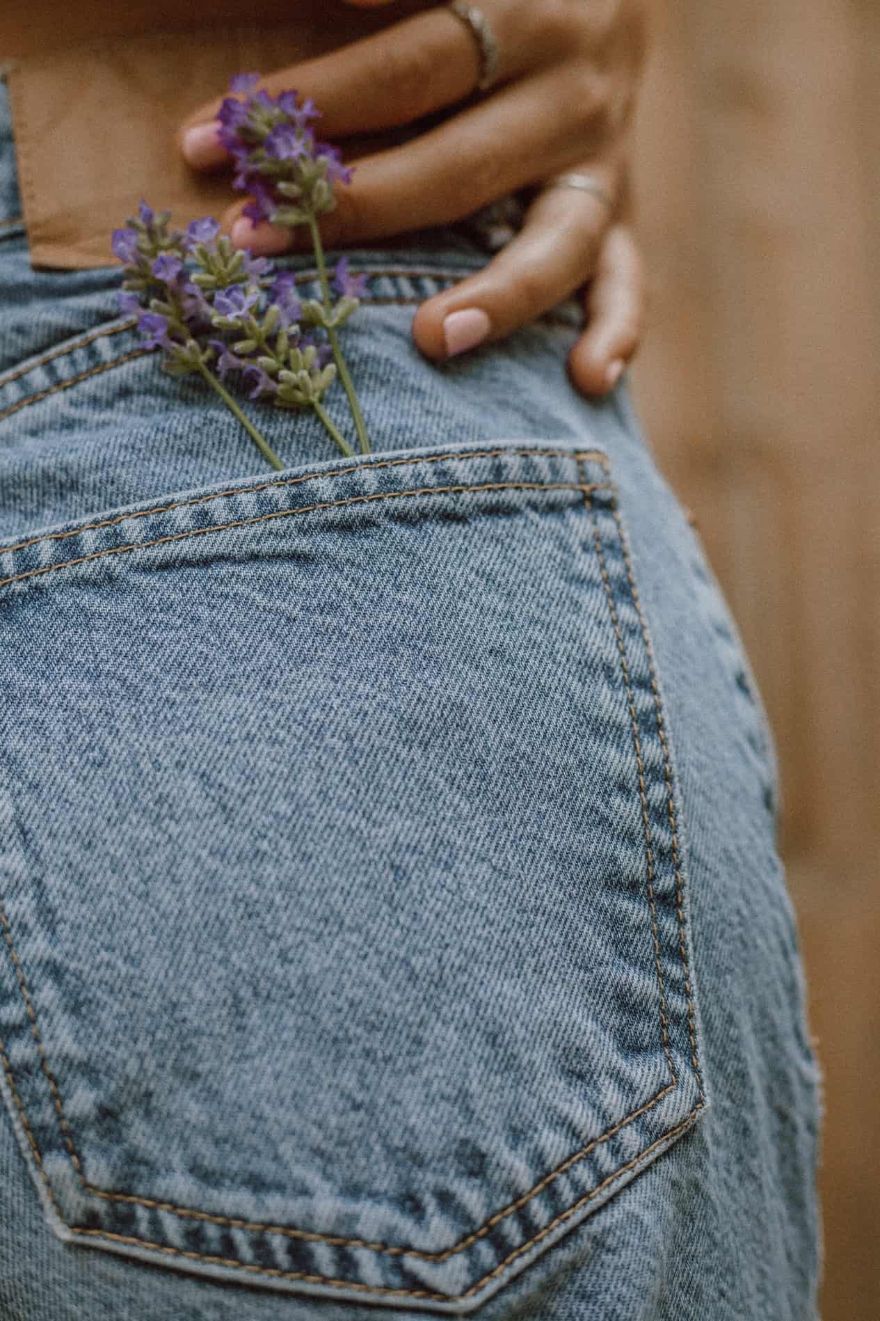 Close up image of the back jean pocket with lavender in the pocket.