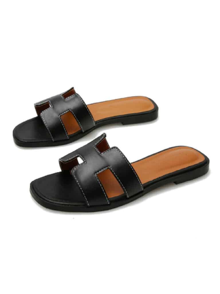 image of a pair of black sandals that look like Hermes Oran sandals