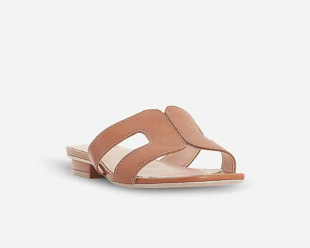 image of a pair of brown leather sandals with a cut-out shape on the top