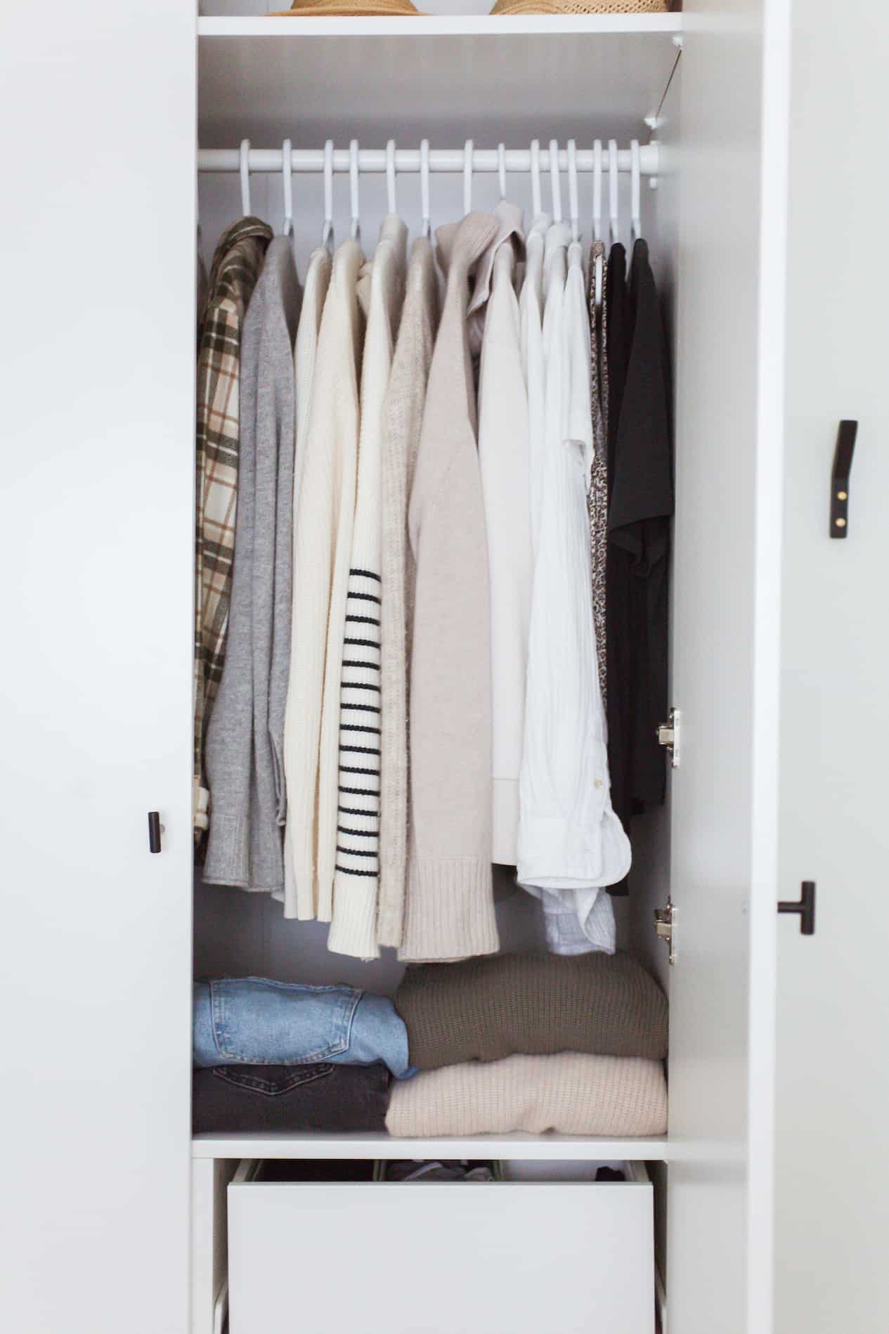 Clothing hung up in a closet.