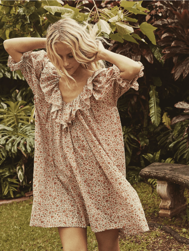image of a blonde woman in a floral flowy mini dress