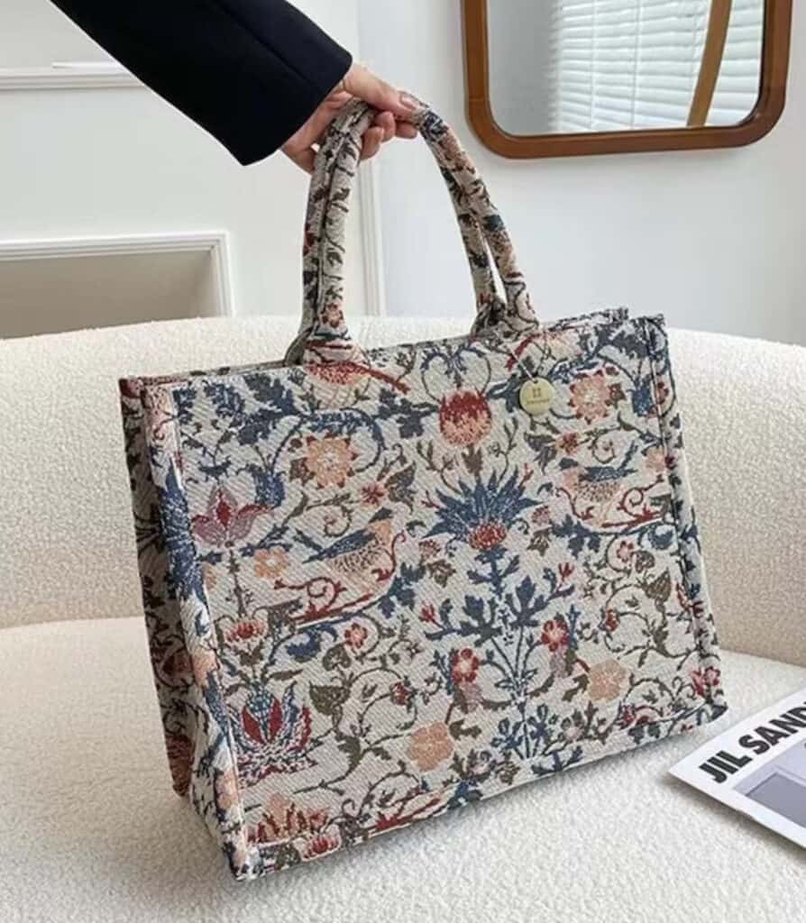 image of a floral embroidered canvas book tote