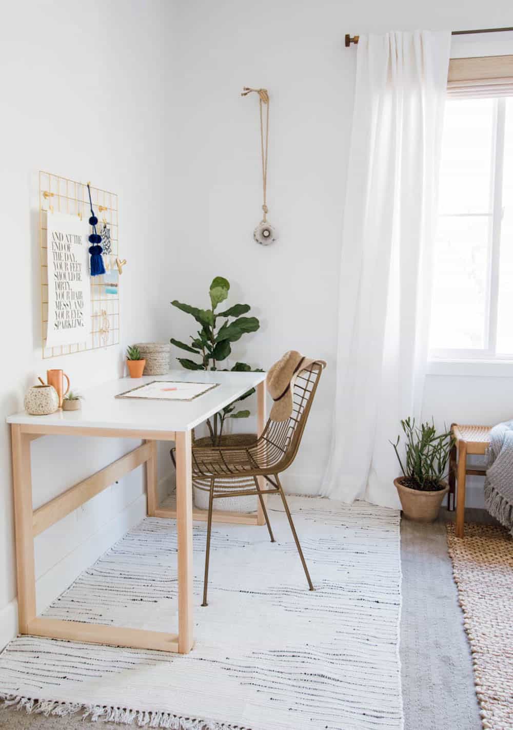 image of a white room with a wood and white desk and simple minimal decor