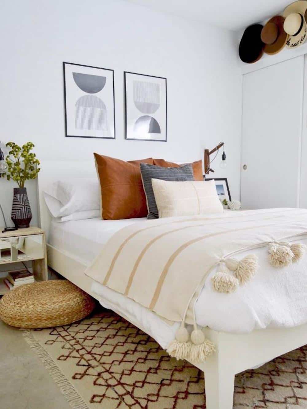 image of a white bedroom with a neutral color pallet and geometric wall wart