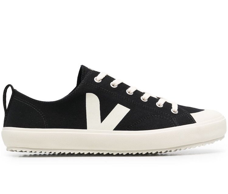 black canvas sneakers with a white V design on the side and a white sole