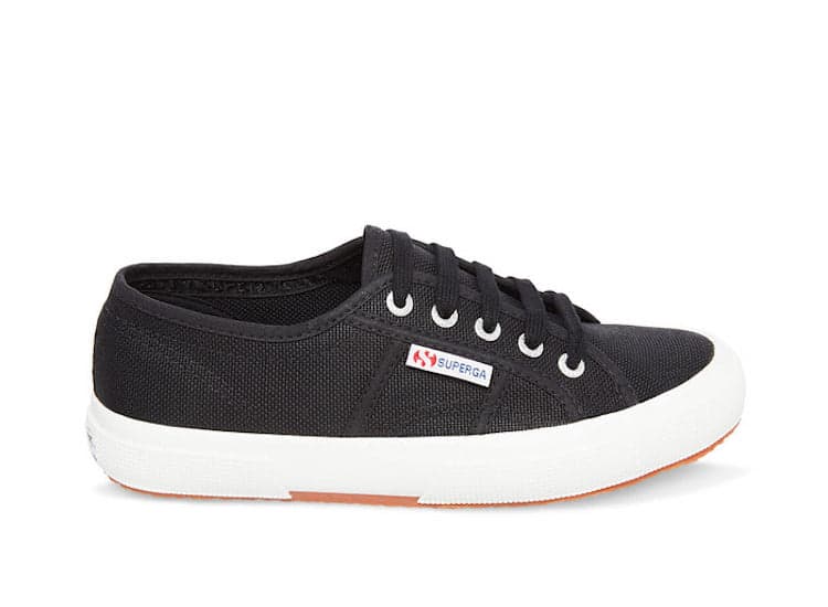 image of a pair of black lace-up canvas sneakers with a white chunky sole