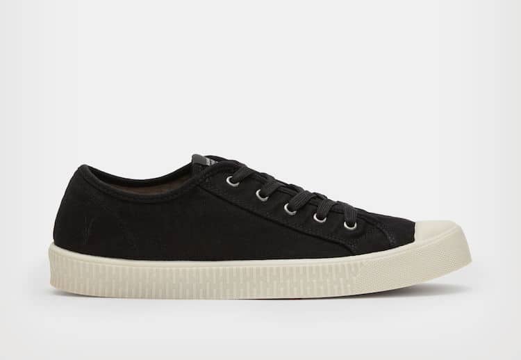 image of a pair of black canvas shoes with a lace up detail and white sole