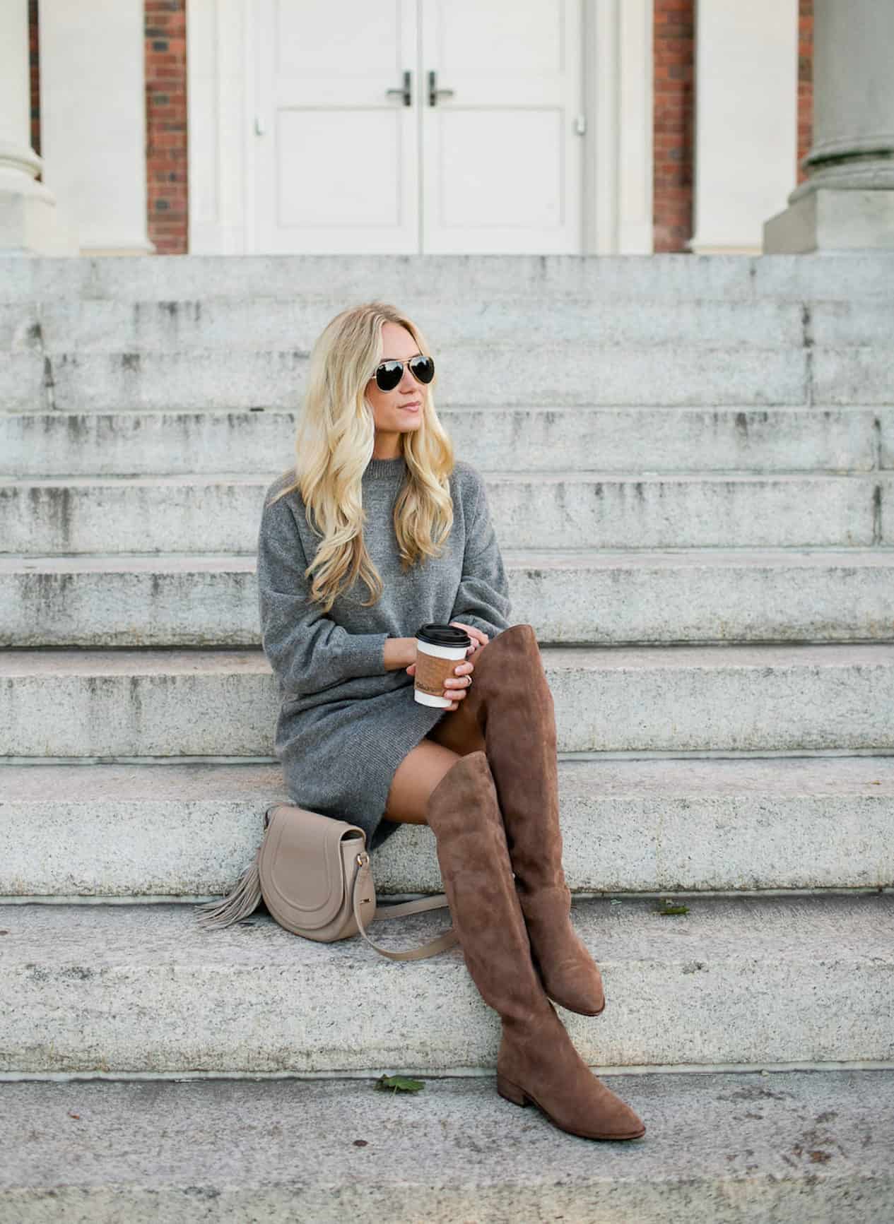 Woman wearing a sweater dress and over the knee boots
