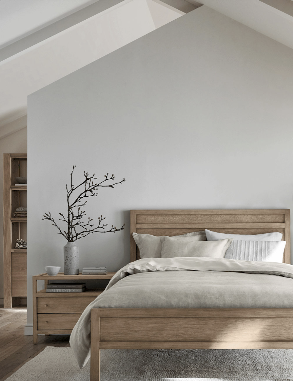 image of a wooden bed and nightstand in a calming neutral room with linen sheets