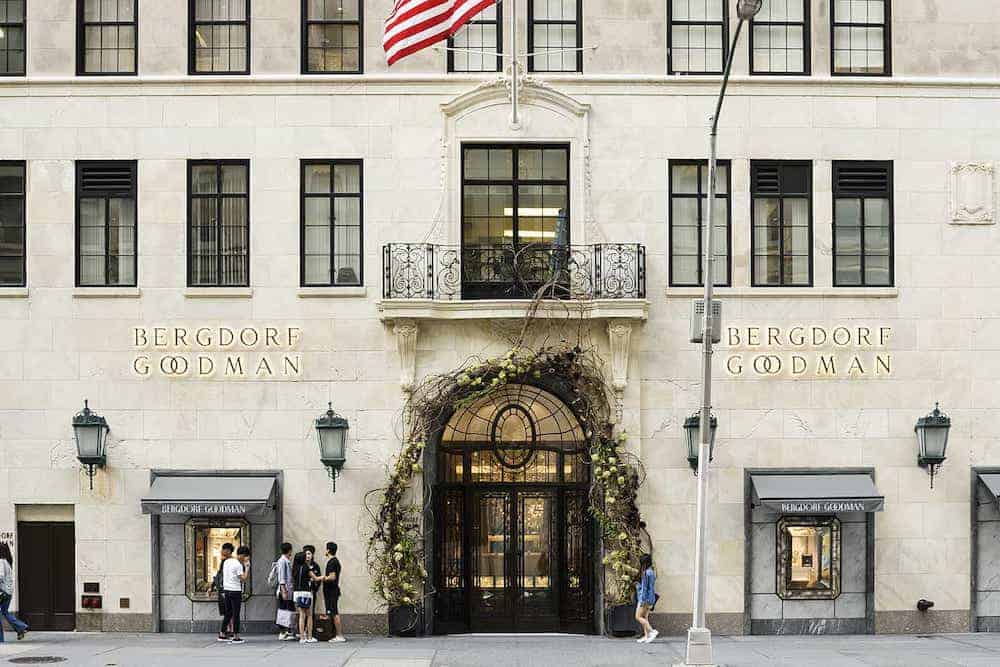 image of a Bergdorf Goodman storefront with a large black door