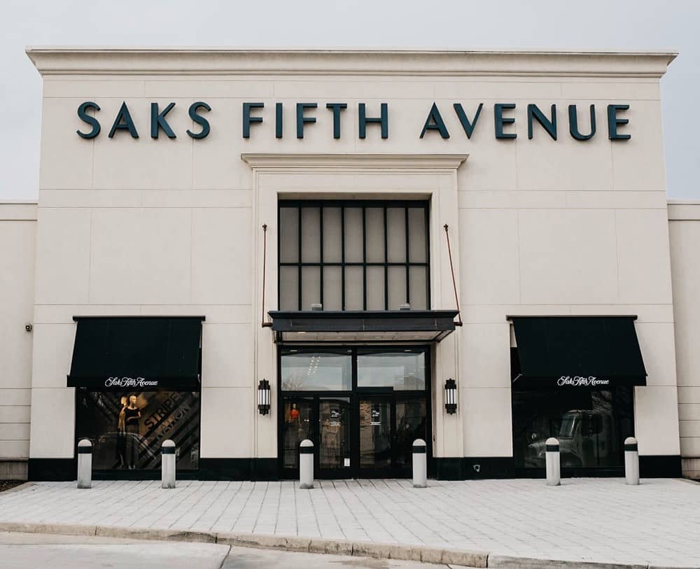 image of a Saks Fifth Avenue storefront with black and beige colors