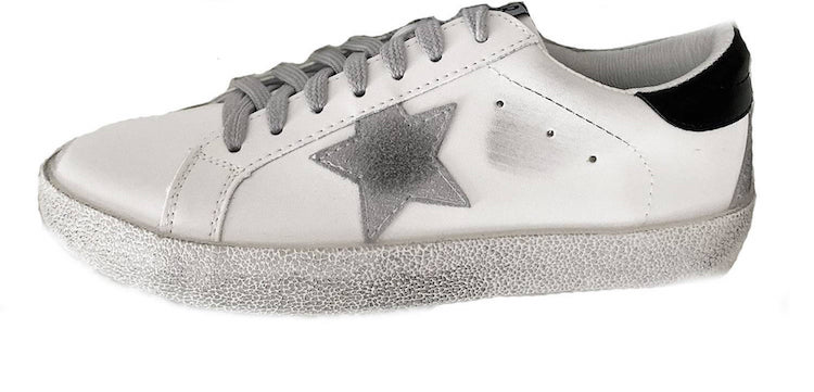image of a white sneakers with distressed and grey star detail on the side