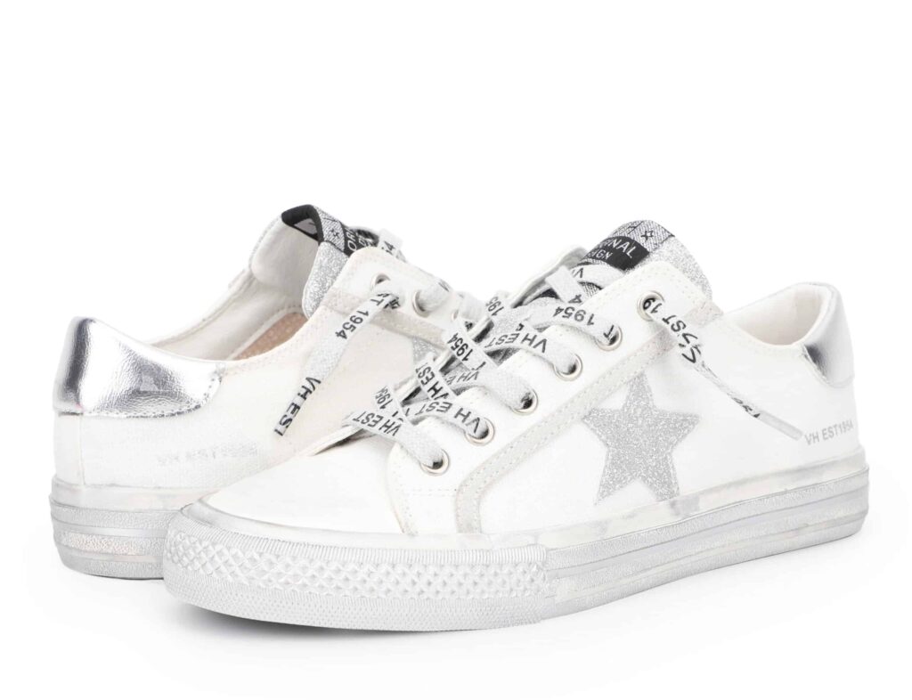 image of a pair of sneakers with a silver glittery star on the side and laces with text