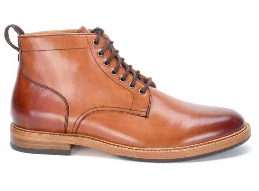 image of a brown leather mans boot with stitching detail and dark laces