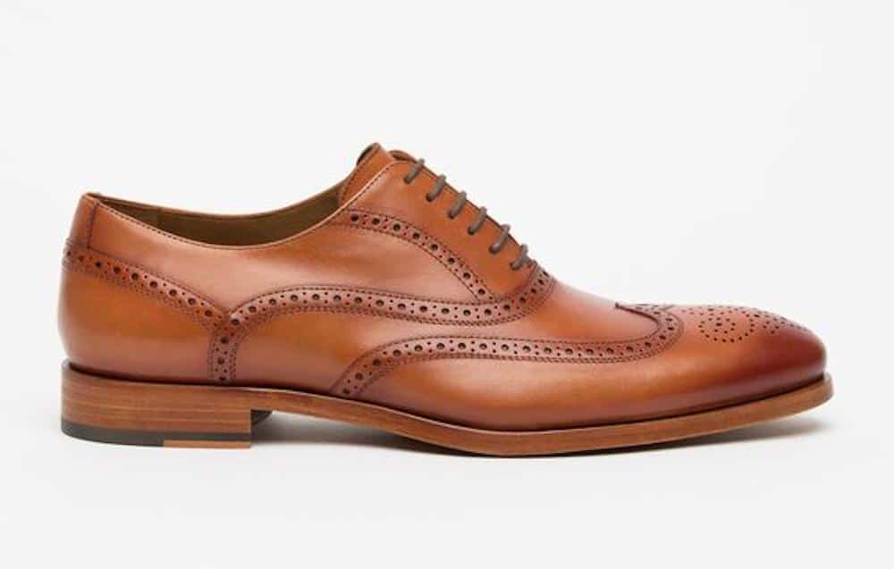 image of a brown leather wingtip dress shoe