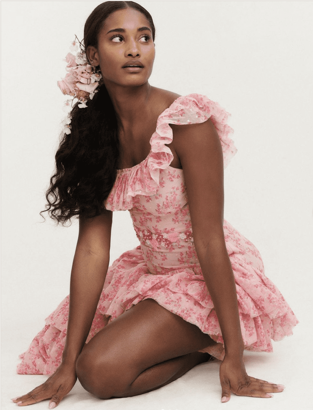 image of a beautiful black woman wearing a pink ruffle maxi gown with a floral print