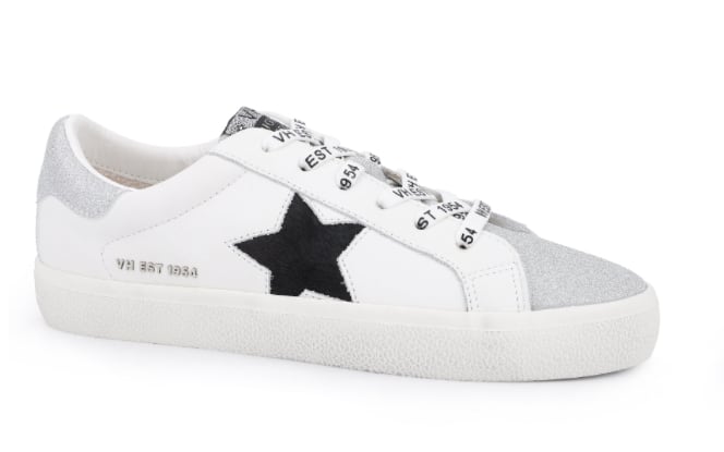 image of a white sneaker with a black star detail on the side and text printed laces