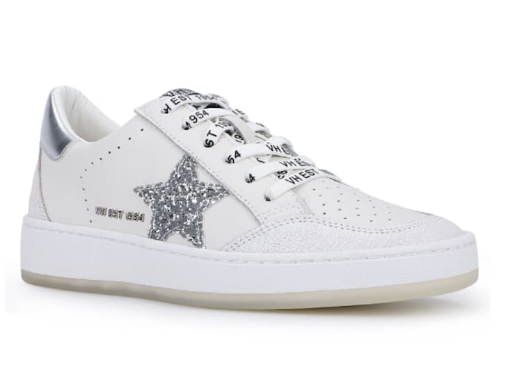 image of a white sneaker with a glittery silver star detail on the side