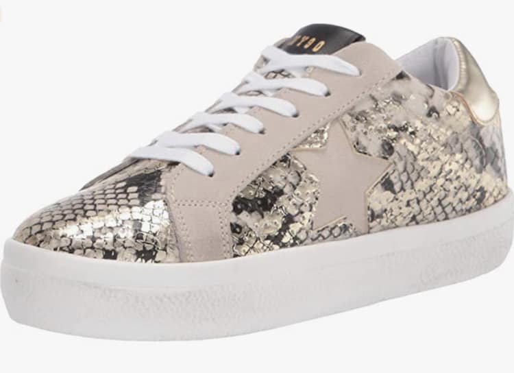 image of a sneaker with a gold snakeskin print and pink suede with a pink suede star detail on the side