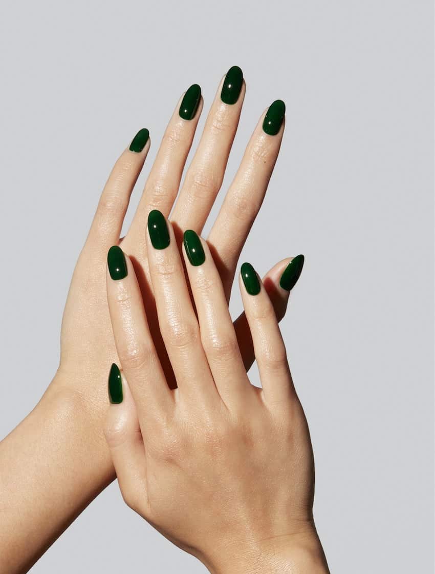 Rounded, solid emerald green nails.
