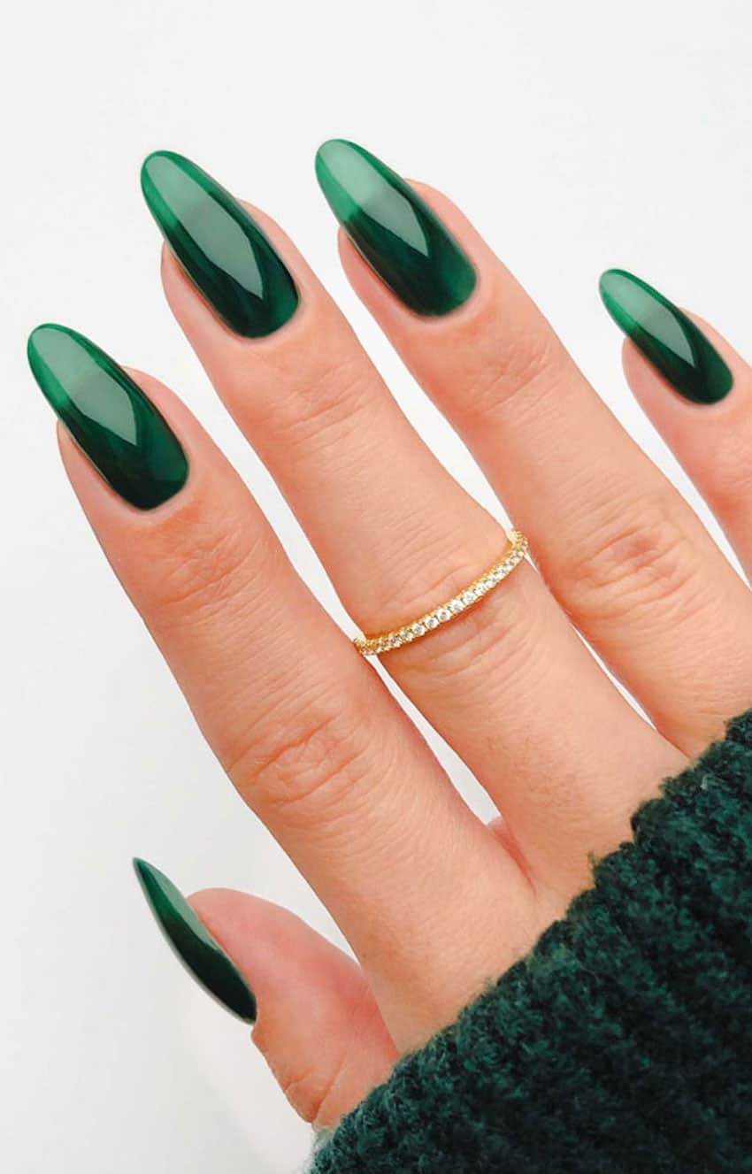 Long rounded transparent emerald green nails.