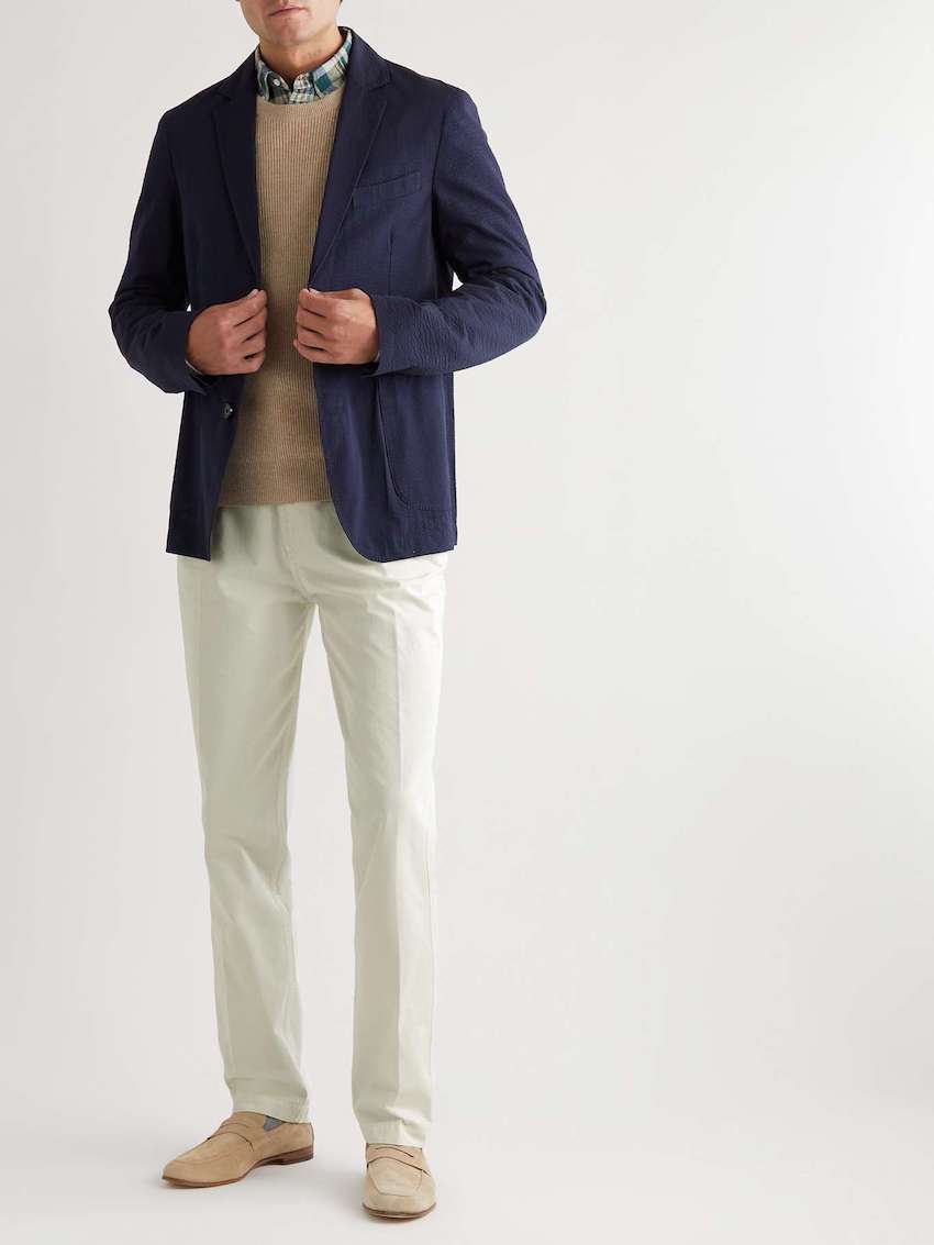 image of a man waring cream chinos with formal loafers and a navy blazer