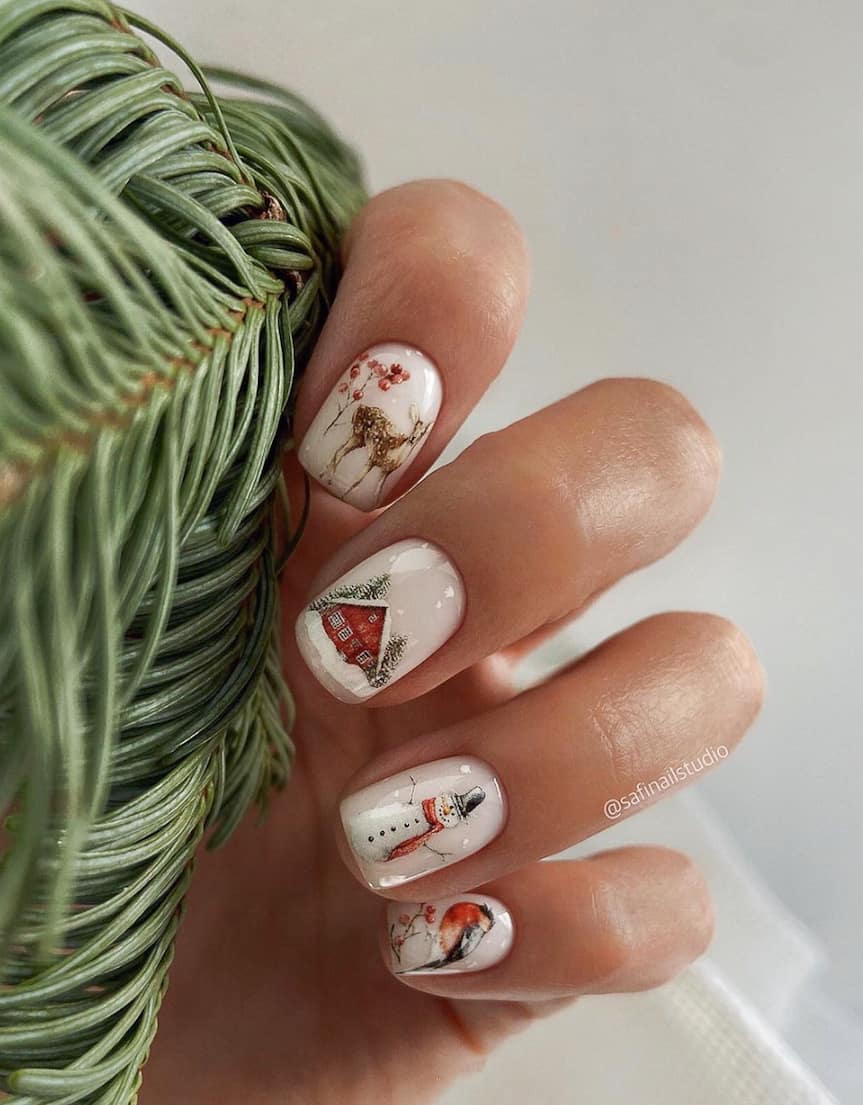 image of a hand with white nails and cute Christmas art