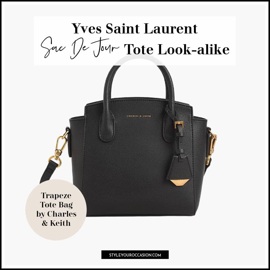 image of a black faux leather tote bag with gold details that's a dupe of the YSL sac de jour