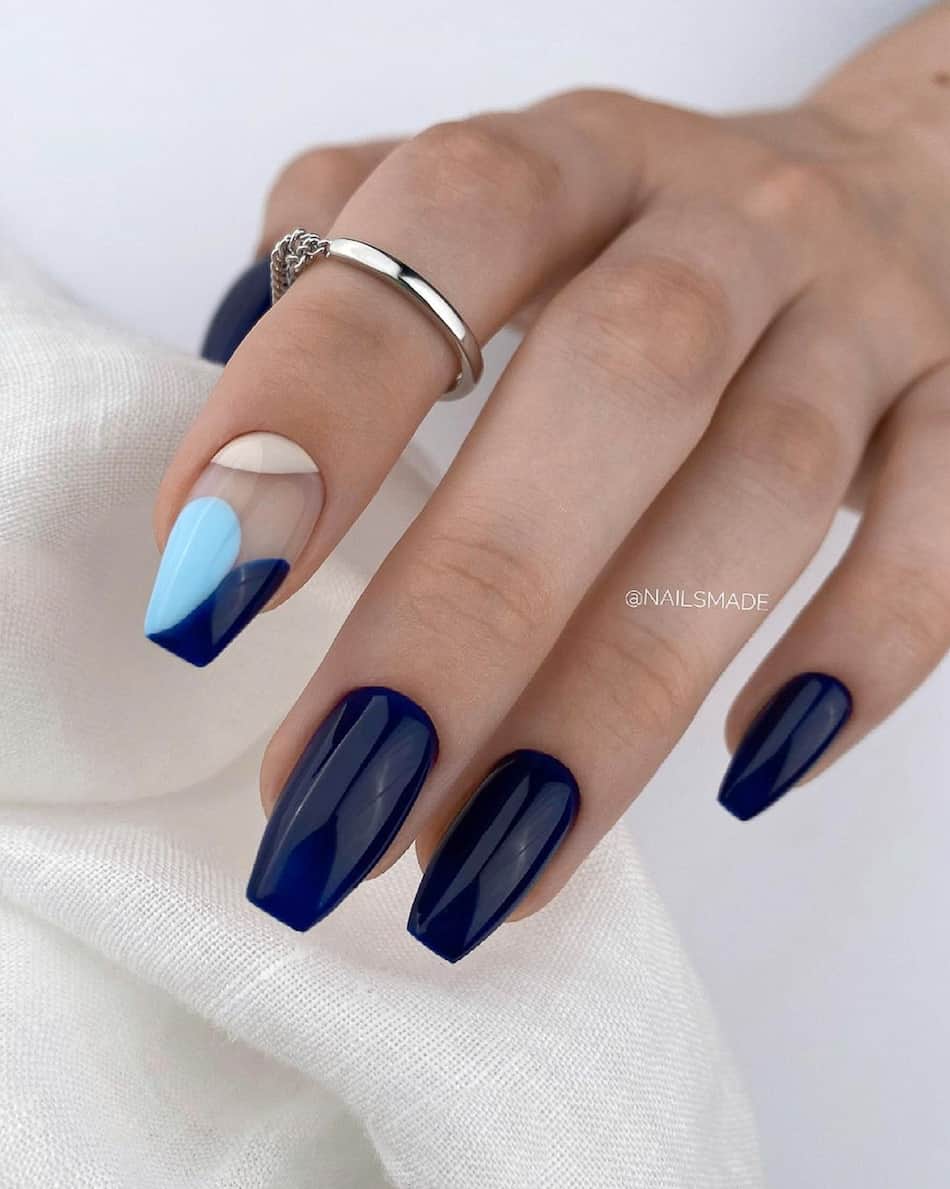 hand with painted navy blue nails