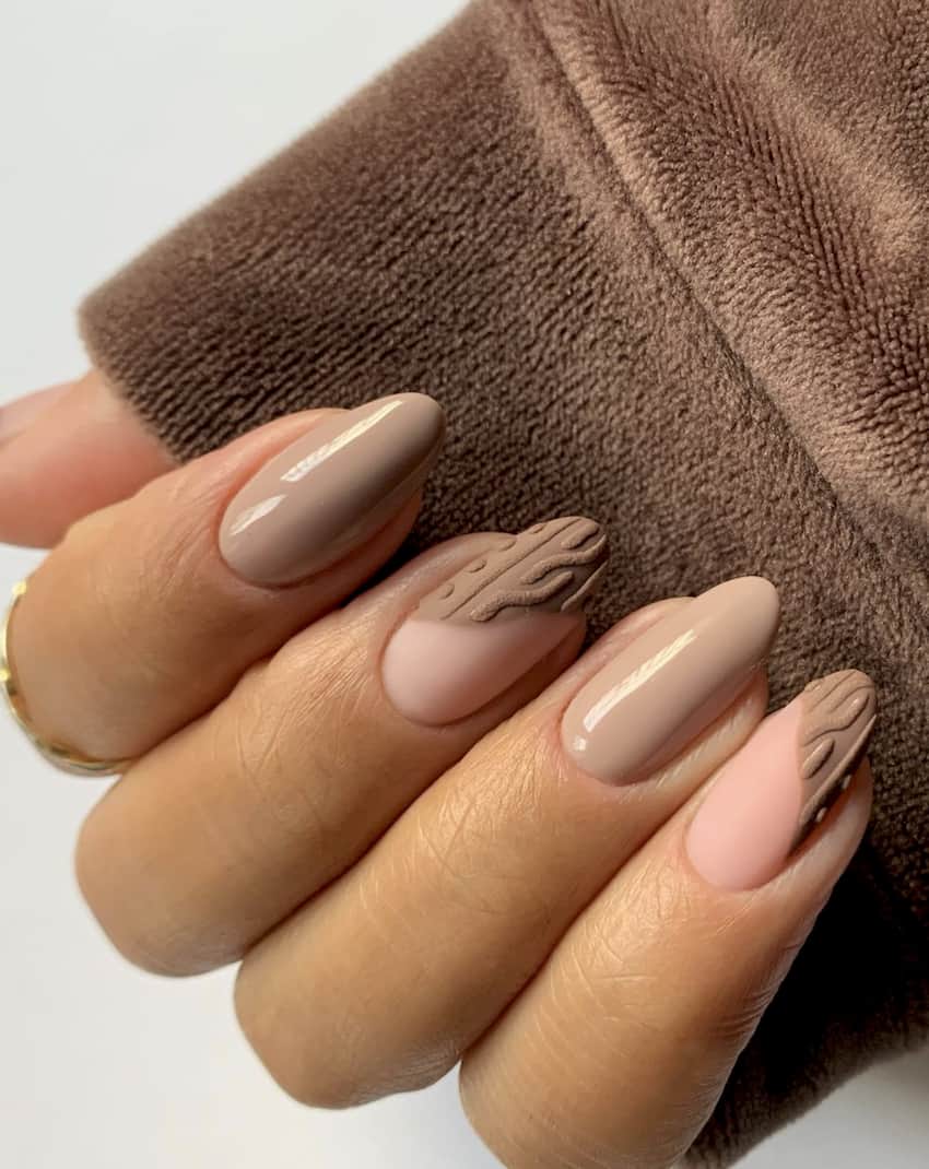 image of a hand with brown and nude textured nails