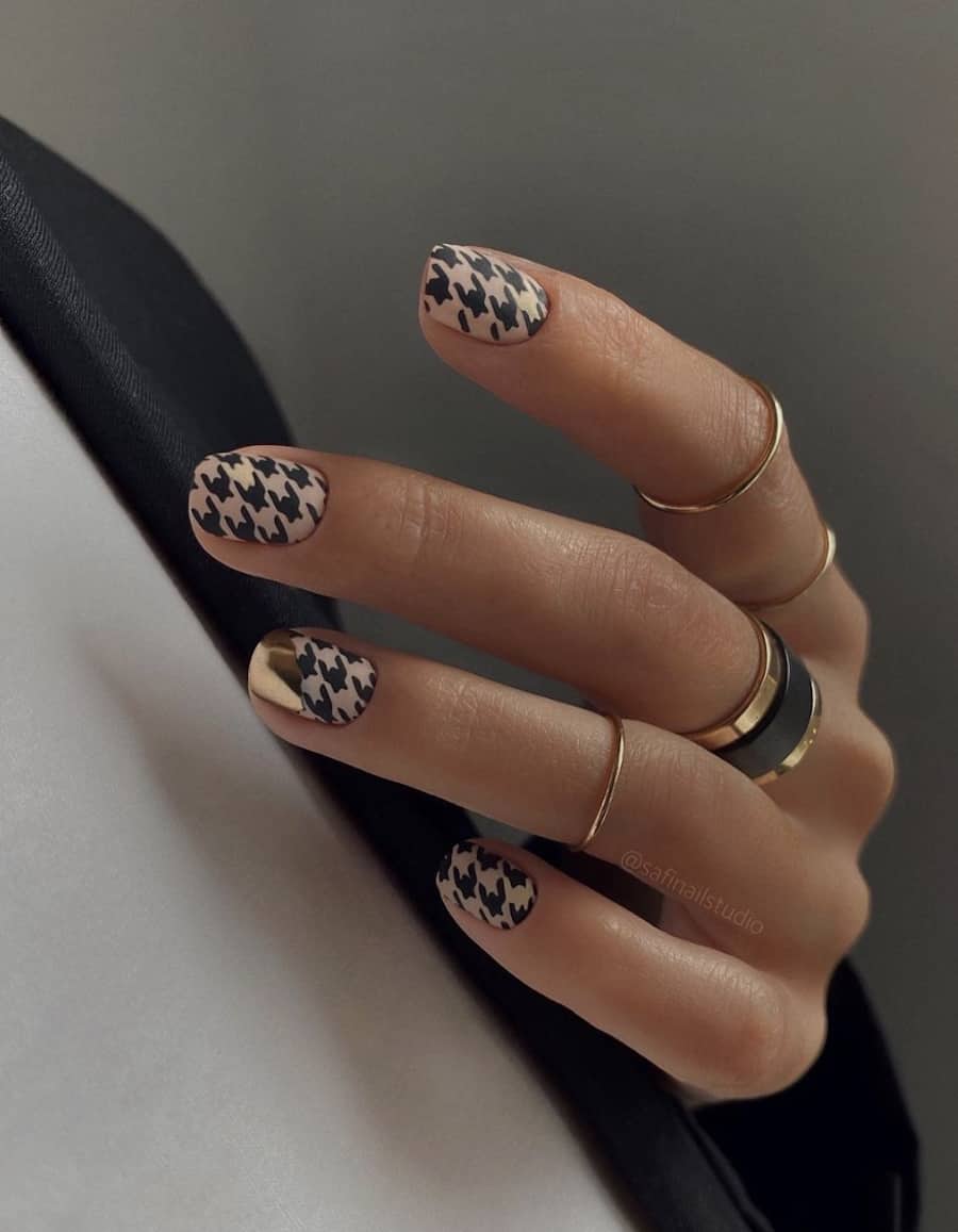 image of a hand with a brown and black houndstooth design