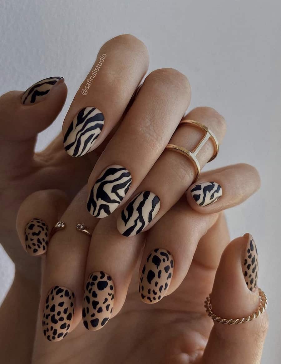 image of a hand with two-tone neutral animal print nails