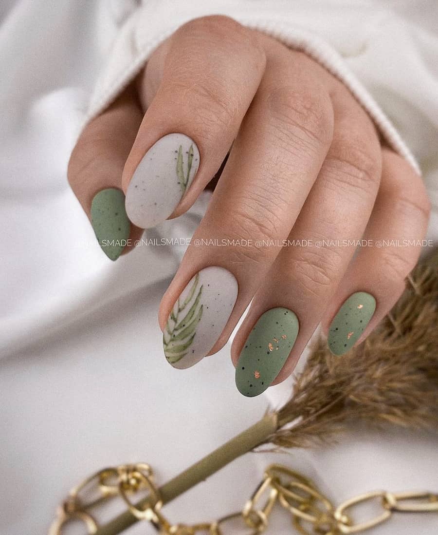 hand with speckled sage green and taupe nails