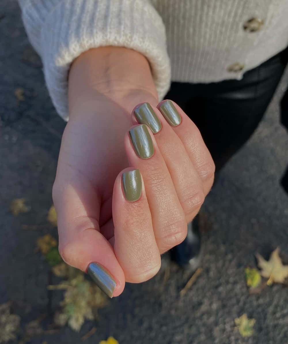 hand with short olive green nails