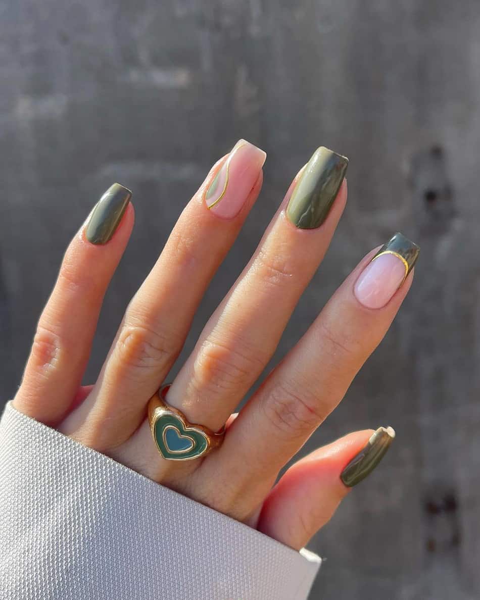 hand with short square nails with olive green and nude accents
