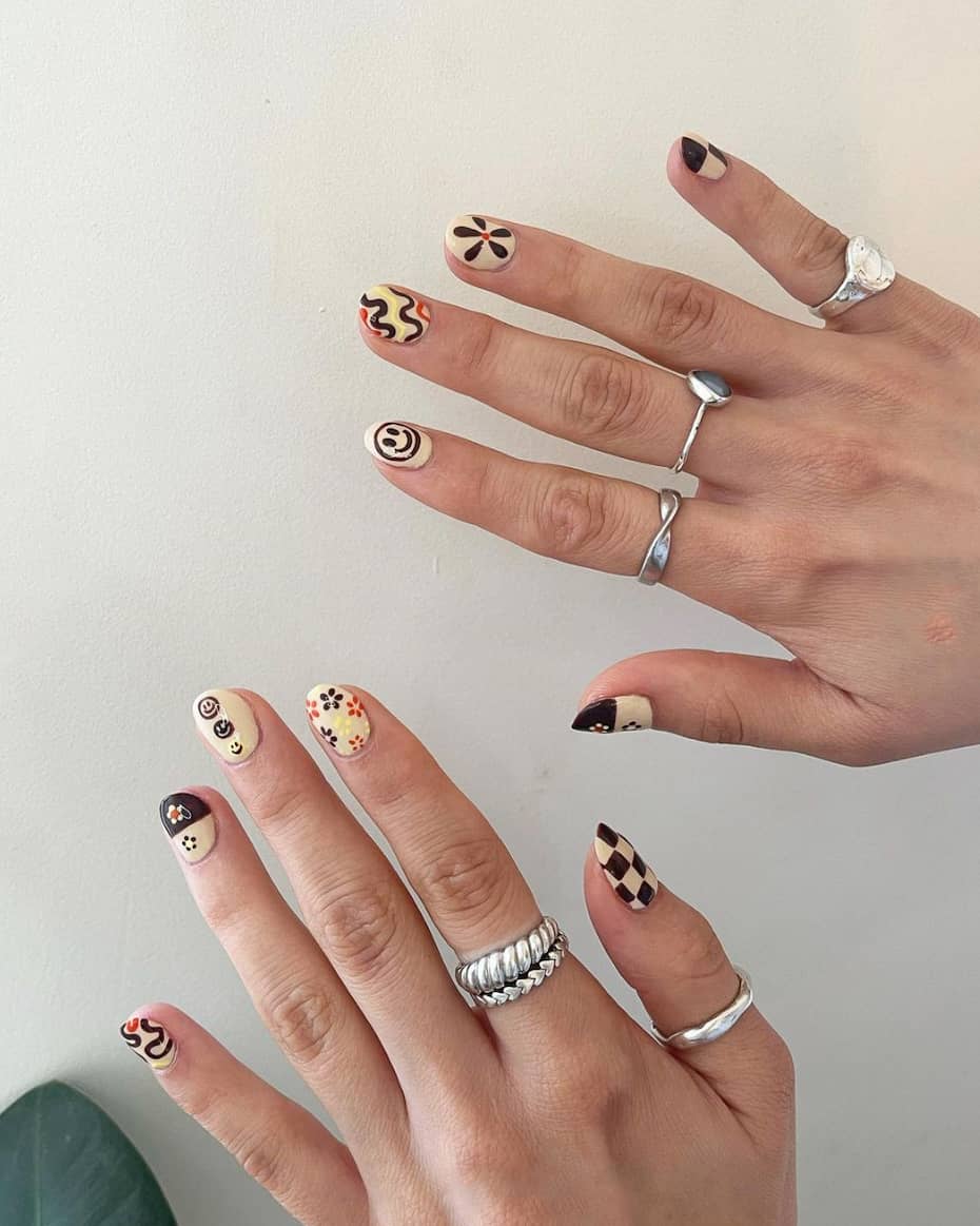 image of a pair of hands with brown and yellow 70s inspired retro nail art