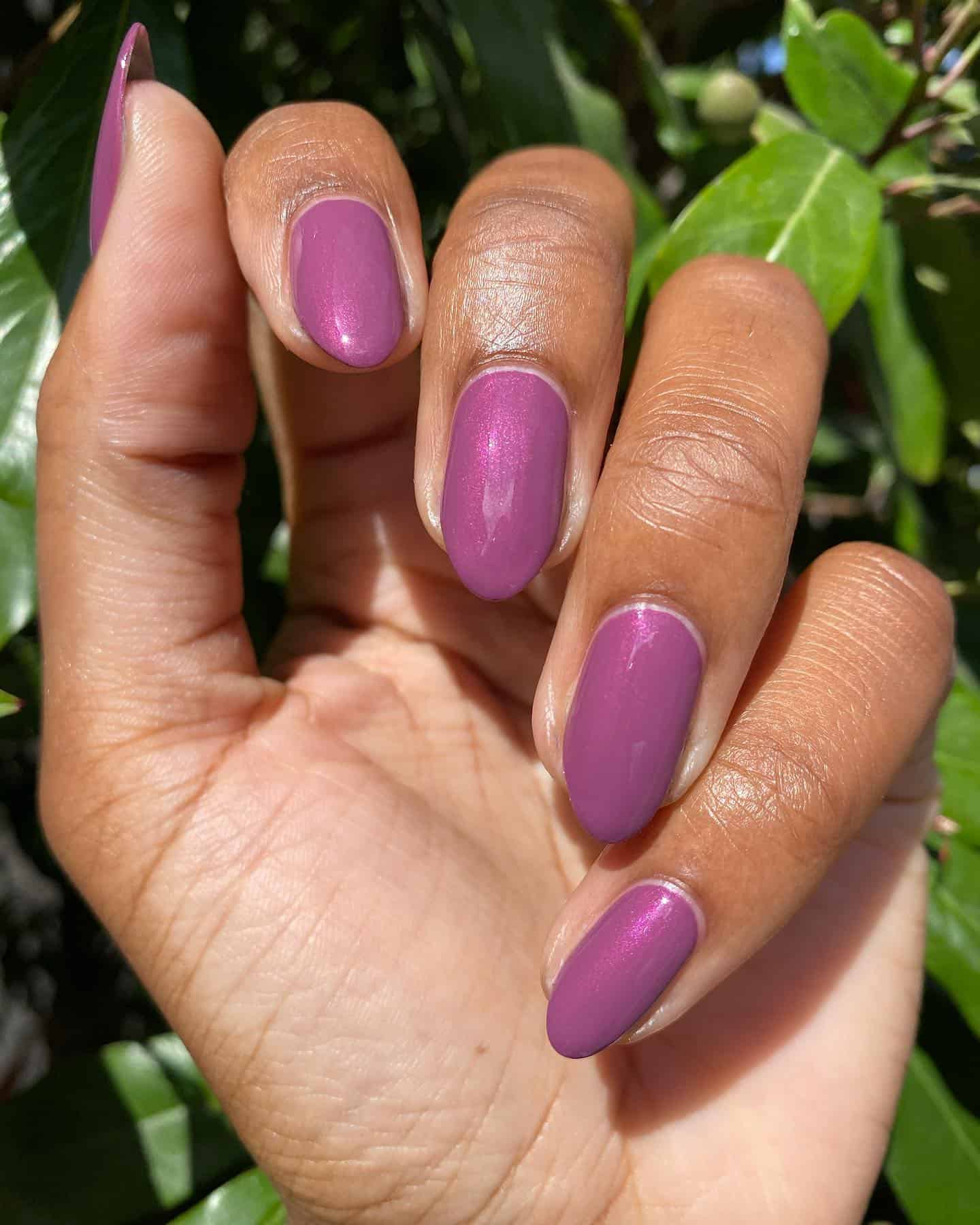 Short, rounded shimmery mauve manicure. This mauve is a medium purple mauve.