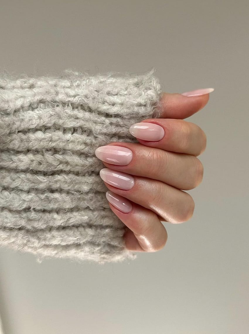 image of a hand with natural nude pink nails 