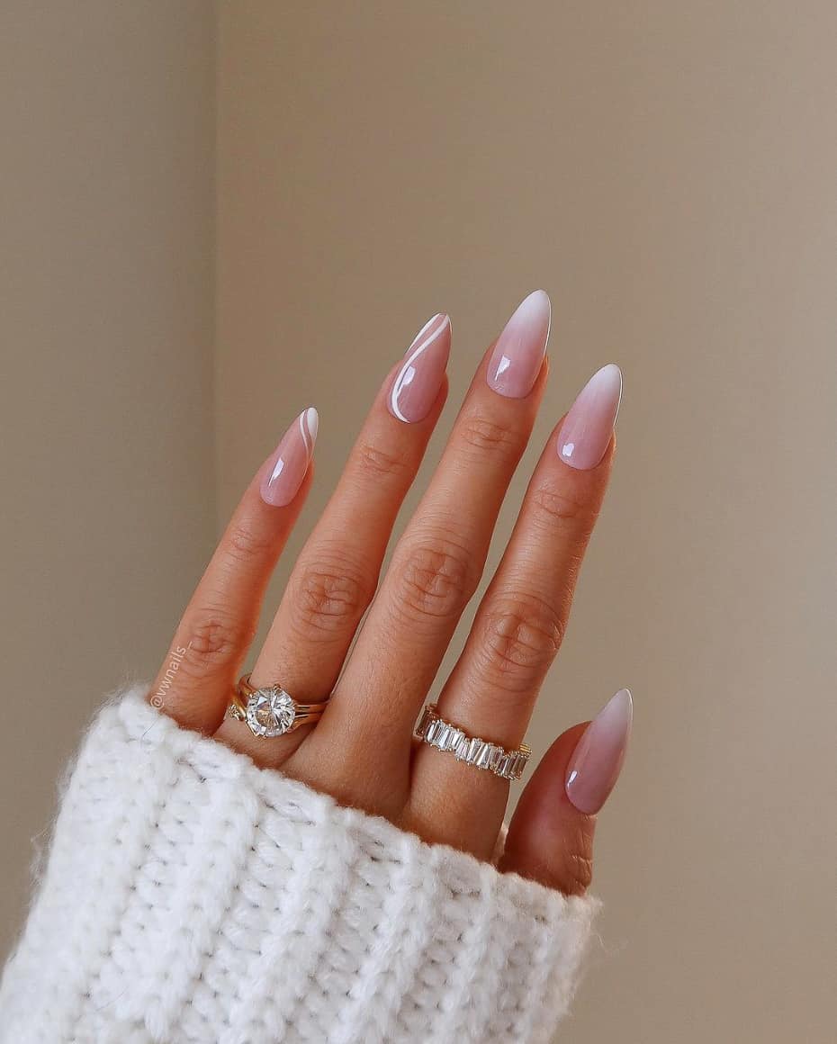 image of a hand with nude pink nails with white nail designs