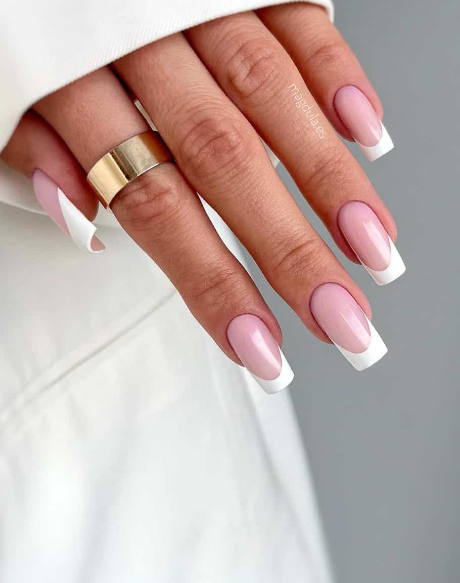 image of a hand with a classic pink and white french tip manicure on long square acrylic nails