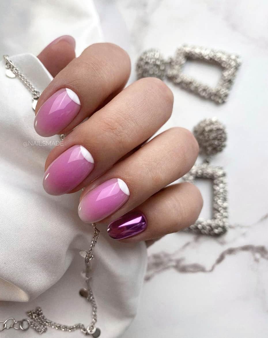 image of a hand with dark pink and white nails with a white moon accent at the cuticle