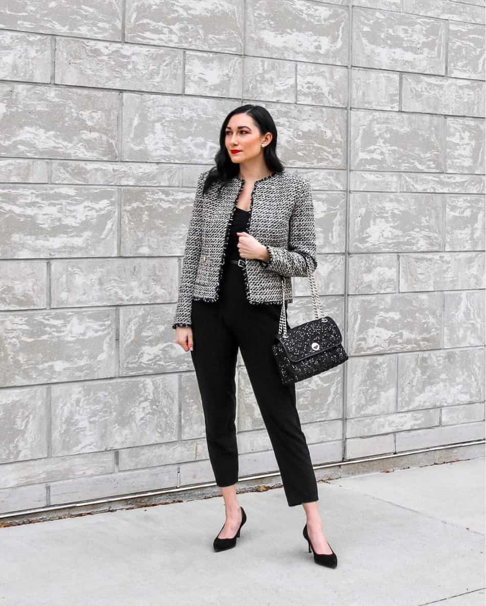 woman wearing a tweed jacket with black pants and black pumps