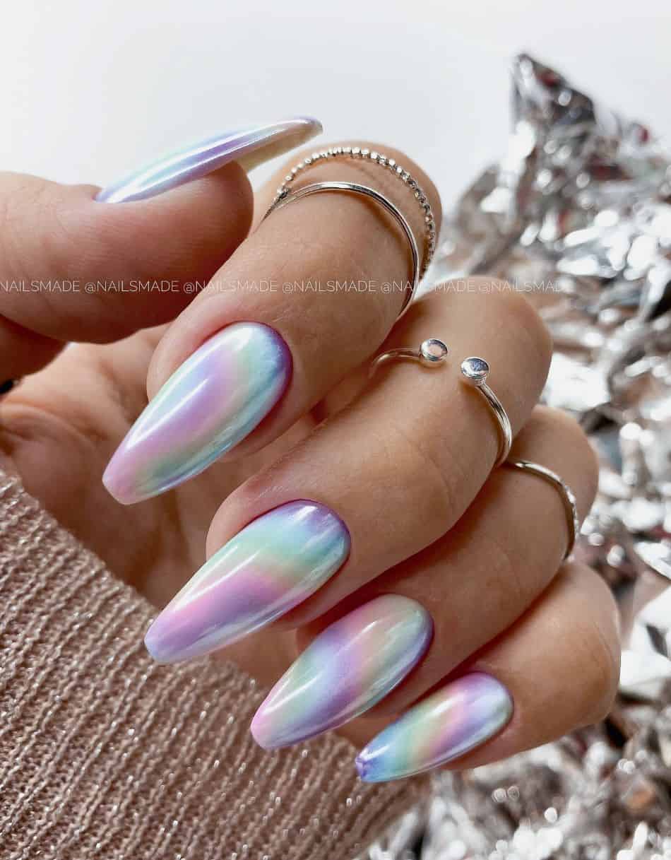 An image of a hand with long iridescent coffin nails