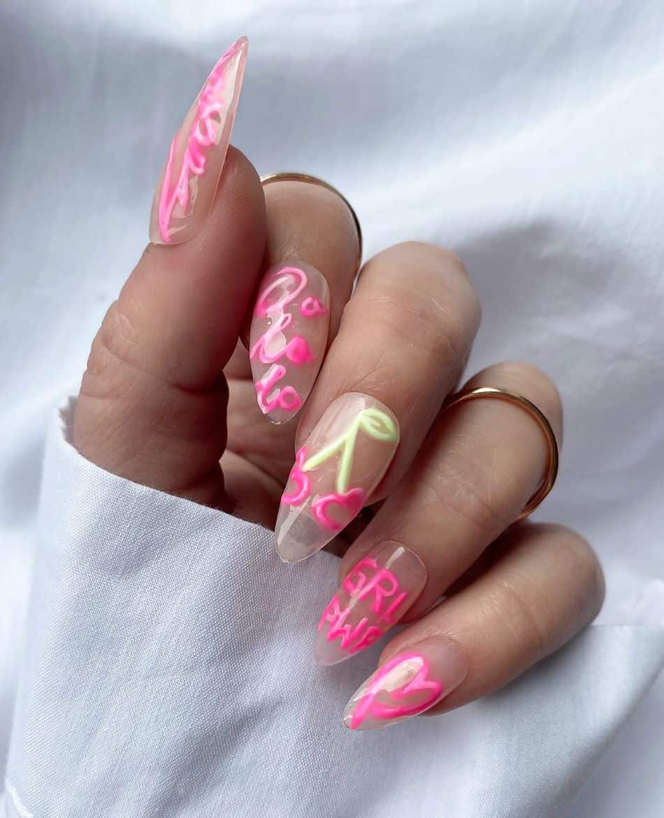 An image of a hand with neon yellow and hot pink 90s nail designs and girl power text