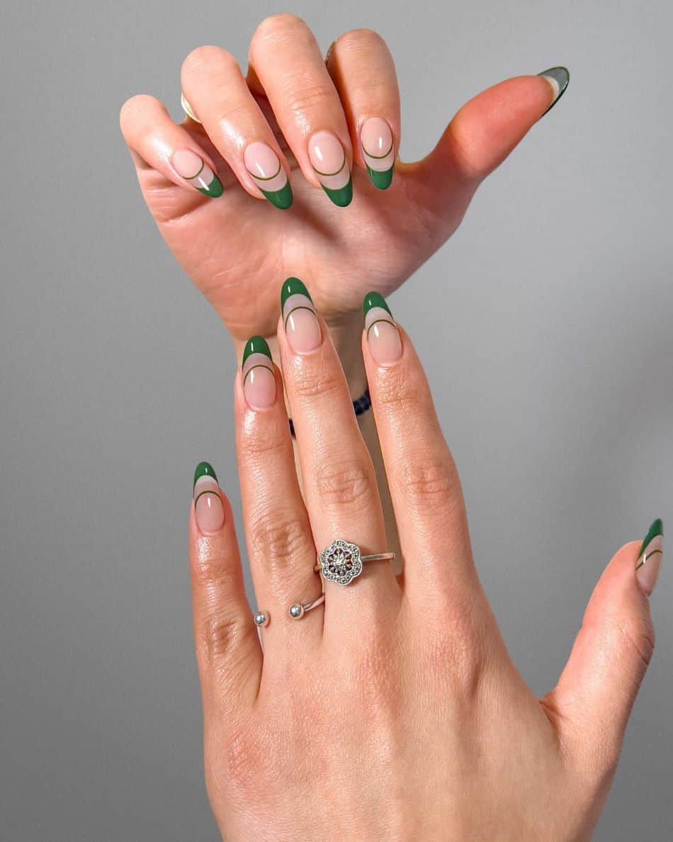 A hand with deep green French tips and line accents