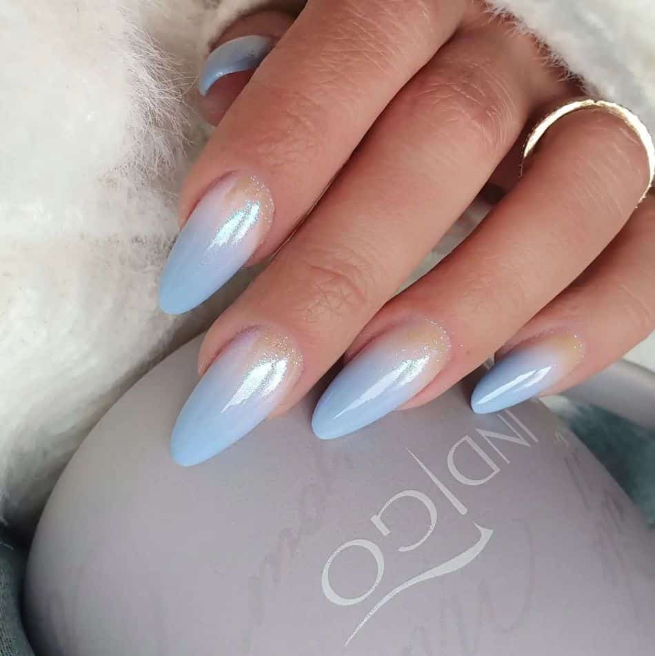 Icy blue ombre nails with glittery base. 
