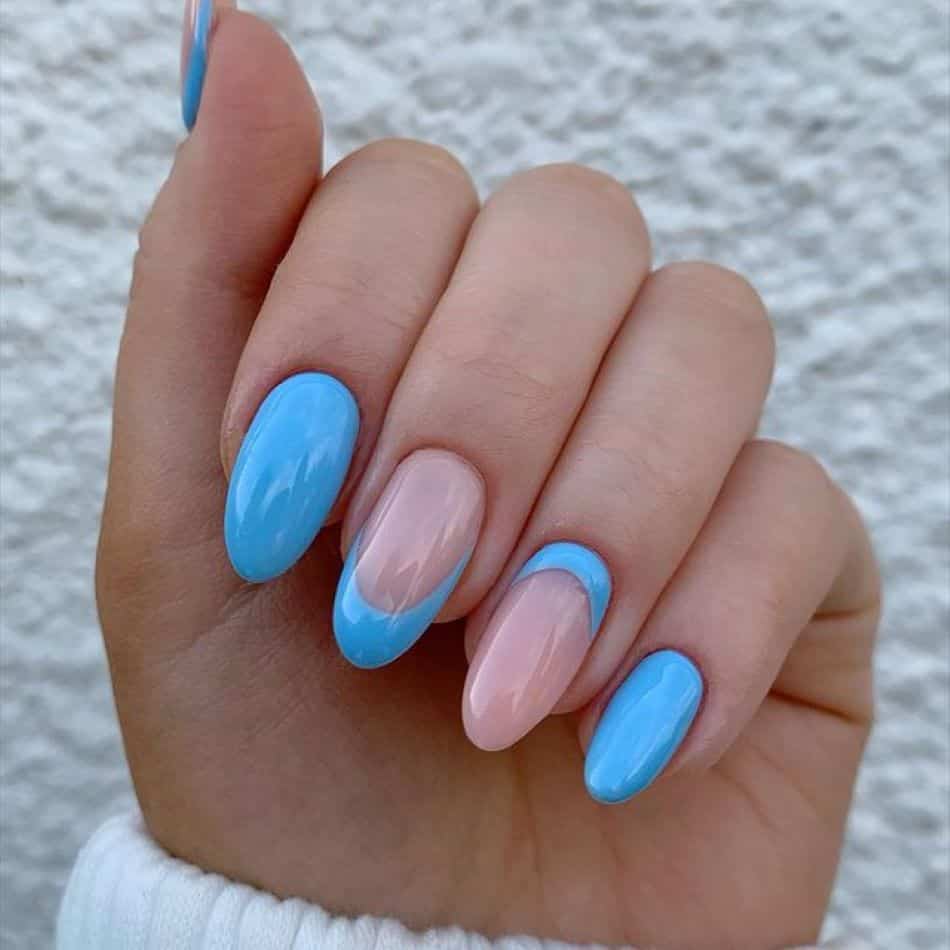 Baby blue gel nails with French tips and reverse French manicure accent nails. 