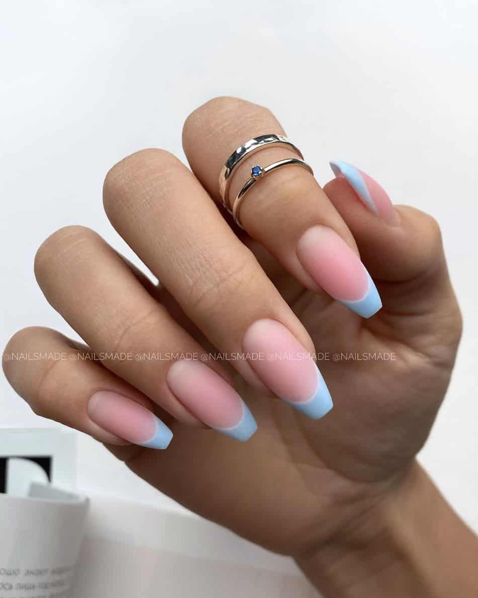 Coffin-shaped nails with pastel blue French tips and a matte finish.