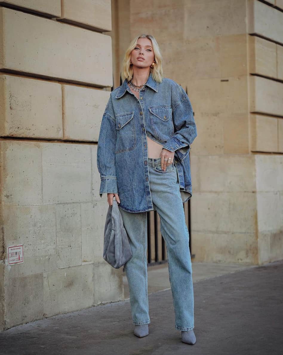 A woman wearing relaxed blue jeans and a blue denim button-up shirt